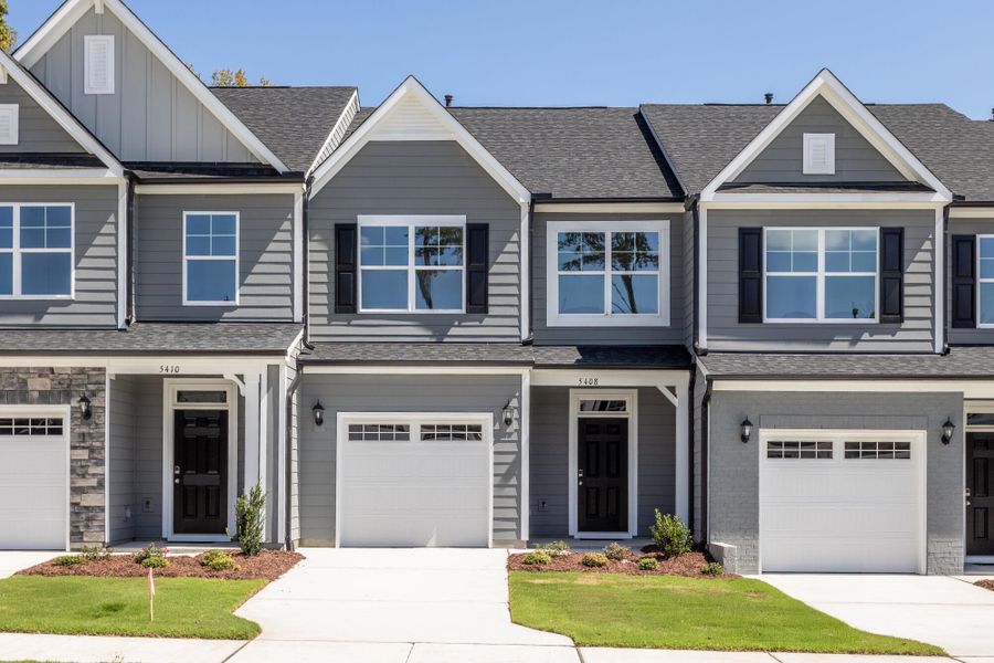 Front exterior of a new home in Running Brook Townes, Durham, NC, highlighting curb appeal (Image 1). Front exterior of a new home in Running Brook Townes, Durham, NC, highlighting curb appeal (Image 1).