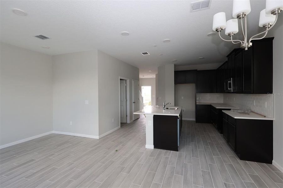 Spacious, unfurnished interior of a new home in Tribute at Ovation, Winter Garden (Image 28).