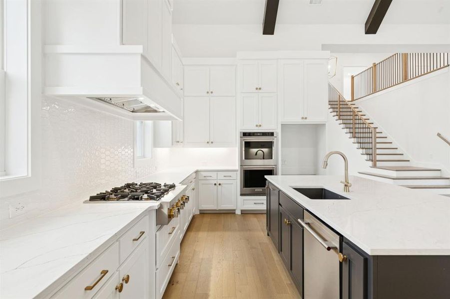 Beautiful cabinetry, gorgeous countertops and designer backsplash paired with top of the line stainless appliances come together to create the kitchen of your dreams! Beautiful cabinetry, gorgeous countertops and designer backsplash paired with top of the line stainless appliances come together to create the kitchen of your dreams!