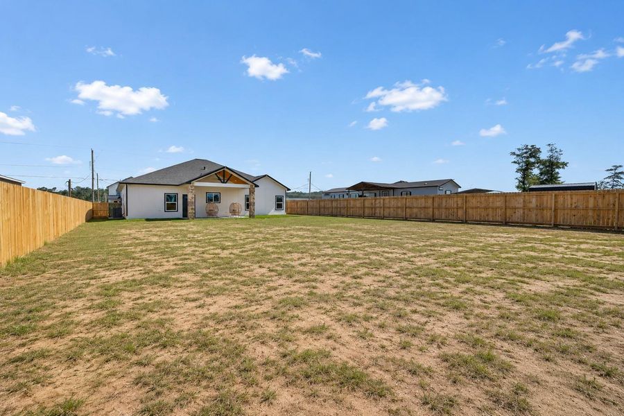 Oversized backyard offering plenty of space for recreation, gardening, or future improvements. Oversized backyard offering plenty of space for recreation, gardening, or future improvements.