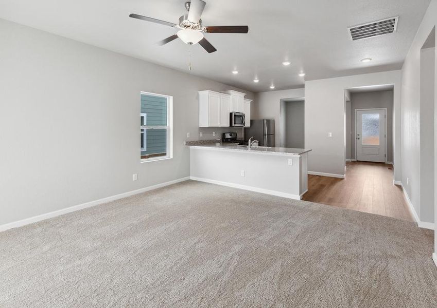 Open layout with the kitchen overlooking the large living room.