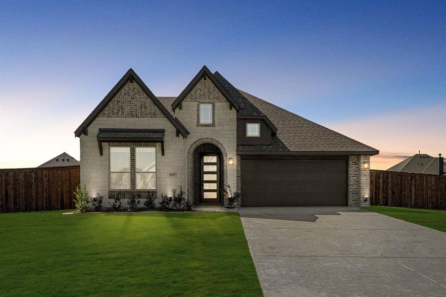Front exterior of a new home in Wildcat Ridge Phase 2 and 4, Godley, TX, highlighting curb appeal (Image 22).