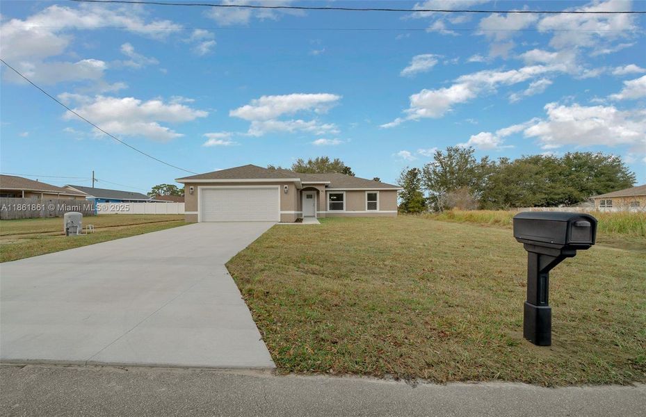 Front exterior of a new home in , Ocala, FL, highlighting curb appeal (Image 1).