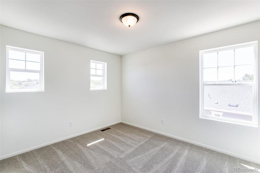 Spacious, unfurnished interior of a new home in Terrain Oak Valley, Castle Rock (Image 29).