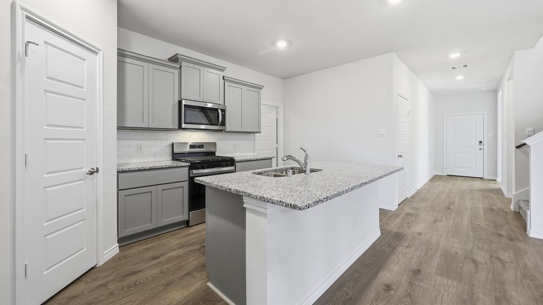 Representative furnished interior of a home built from the Palmview by D.R. Horton in Winchester Crossing, Princeton (Image 5).