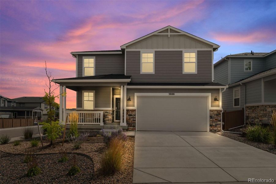 Front exterior of a new home in Sunstone Village at Terrain, Castle Rock, CO, highlighting curb appeal (Image 19).