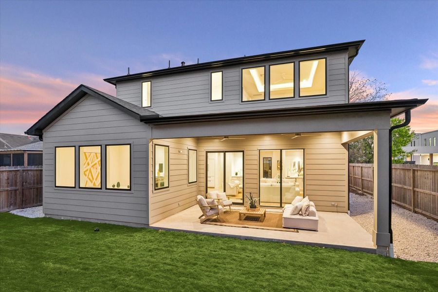 Enjoy the spacious backyard with lush zoysia grass, French drains, and holly bushes along the fence. The perfect place for your loved ones to run and play!