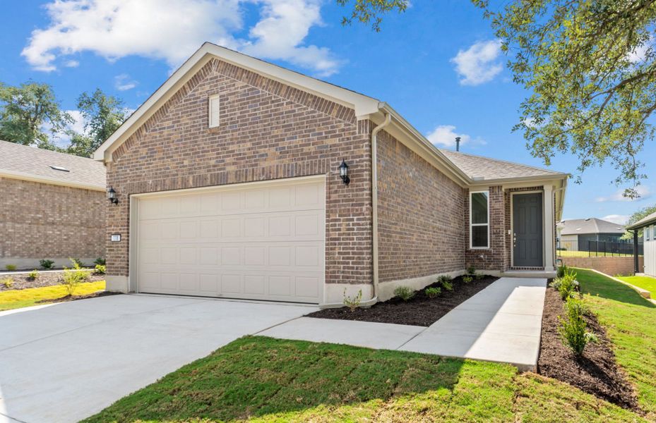 Front exterior of a new home in Sun City Texas, Georgetown, TX, highlighting curb appeal (Image 18). Front exterior of a new home in Sun City Texas, Georgetown, TX, highlighting curb appeal (Image 18).
