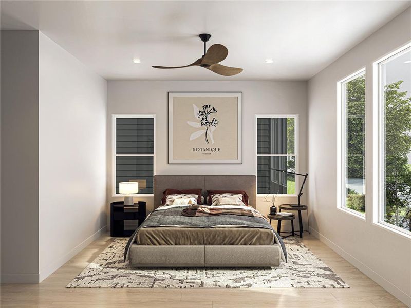 This is a modern bedroom with clean lines, featuring a large bed with stylish bedding, a patterned area rug, and a minimalist decor. The room includes a ceiling fan, ample natural light from large windows, and a peaceful view of greenery outside.