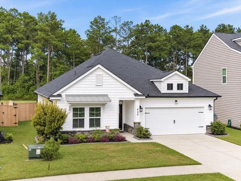 Front exterior of a new home in , Moncks Corner, SC, highlighting curb appeal (Image 1). Front exterior of a new home in , Moncks Corner, SC, highlighting curb appeal (Image 1).