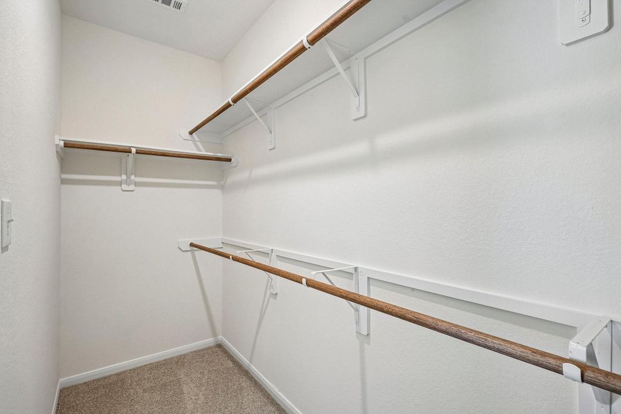 Walk-in closet in the owner's suite Walk-in closet in the owner's suite
