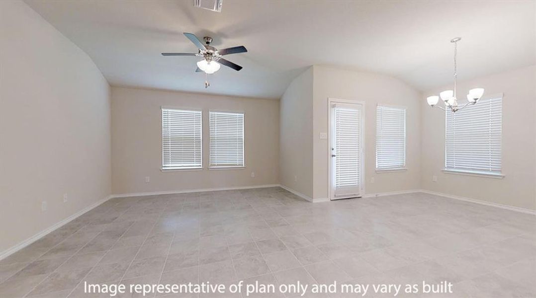Empty room with vaulted ceiling, a chandelier, and a ceiling fan Empty room with vaulted ceiling, a chandelier, and a ceiling fan