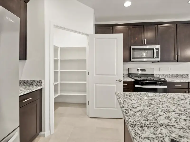 Furnished interior view inside a new home in Mandarina - Premier Series, Marana (Image 4). Furnished interior view inside a new home in Mandarina - Premier Series, Marana (Image 4).