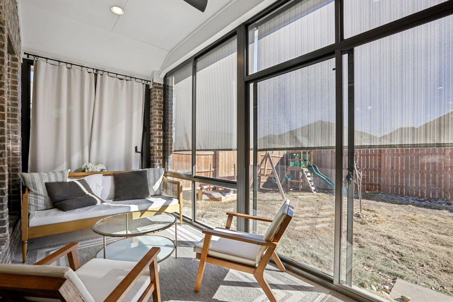 Sunroom with floor to ceiling windows