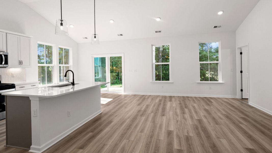 Spacious open-concept design with vaulted ceilings and bright natural light