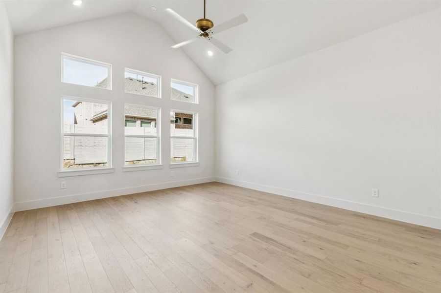 The soft, neutral color palette continues into your dreamy owner's suite which is located at the rear of the home for additional privacy.