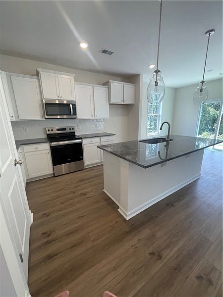 Furnished interior view inside a new home in Springwood Grove, Central (Image 4).