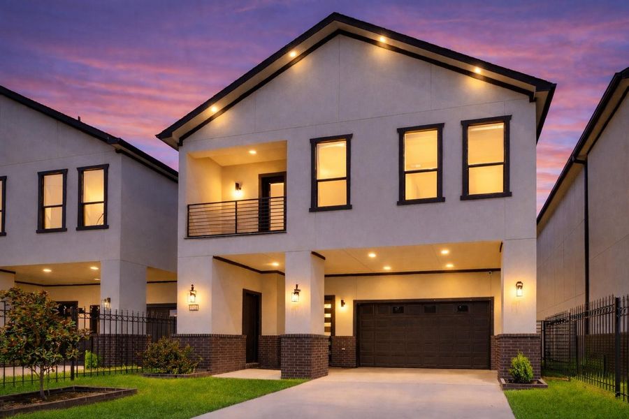 The front elevation stands out with a fresh contemporary profile, defined by smooth stucco, deep-toned accents, and a second-story balcony that adds depth and dimension. The front elevation stands out with a fresh contemporary profile, defined by smooth stucco, deep-toned accents, and a second-story balcony that adds depth and dimension.
