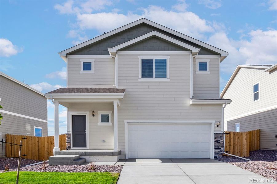 Front exterior of a new home in Bennett Ranch, Bennett, CO, highlighting curb appeal (Image 1).
