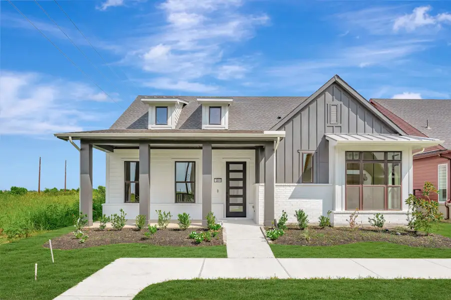 Front exterior of a new home in Indigo - Enclave Collection, Richmond, TX, highlighting curb appeal (Image 2). Front exterior of a new home in Indigo - Enclave Collection, Richmond, TX, highlighting curb appeal (Image 2).