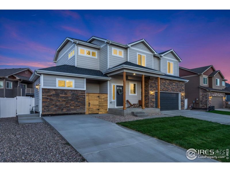 Front exterior of a new home in , Wellington, CO, highlighting curb appeal (Image 21).