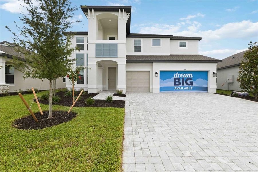 Front exterior of a new home in Creeks Edge at Twin Rivers, Parrish, FL, highlighting curb appeal (Image 26). Front exterior of a new home in Creeks Edge at Twin Rivers, Parrish, FL, highlighting curb appeal (Image 26).