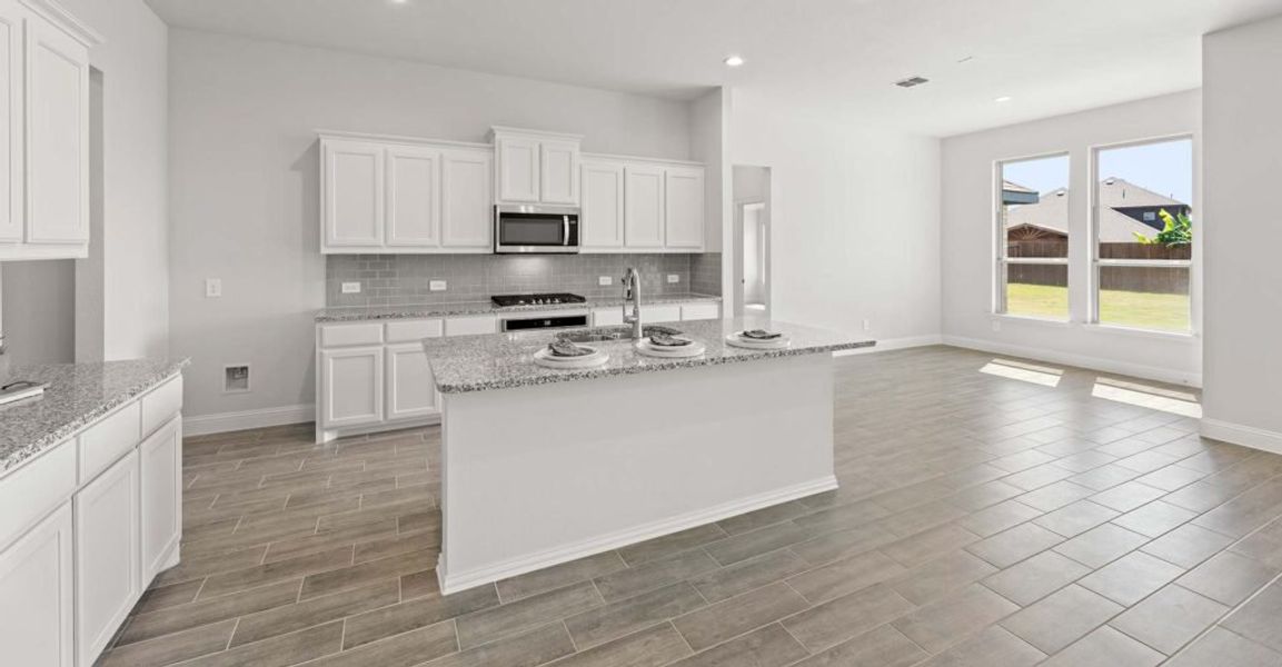 Representative exterior photo of a completed home built from the Hampton by Impression Homes in Still Water Lake, Godley, TX (Image 6). Representative exterior photo of a completed home built from the Hampton by Impression Homes in Still Water Lake, Godley, TX (Image 6).