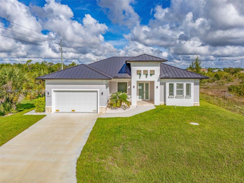 Front exterior of a new home in , Port Charlotte, FL, highlighting curb appeal (Image 23). Front exterior of a new home in , Port Charlotte, FL, highlighting curb appeal (Image 23).