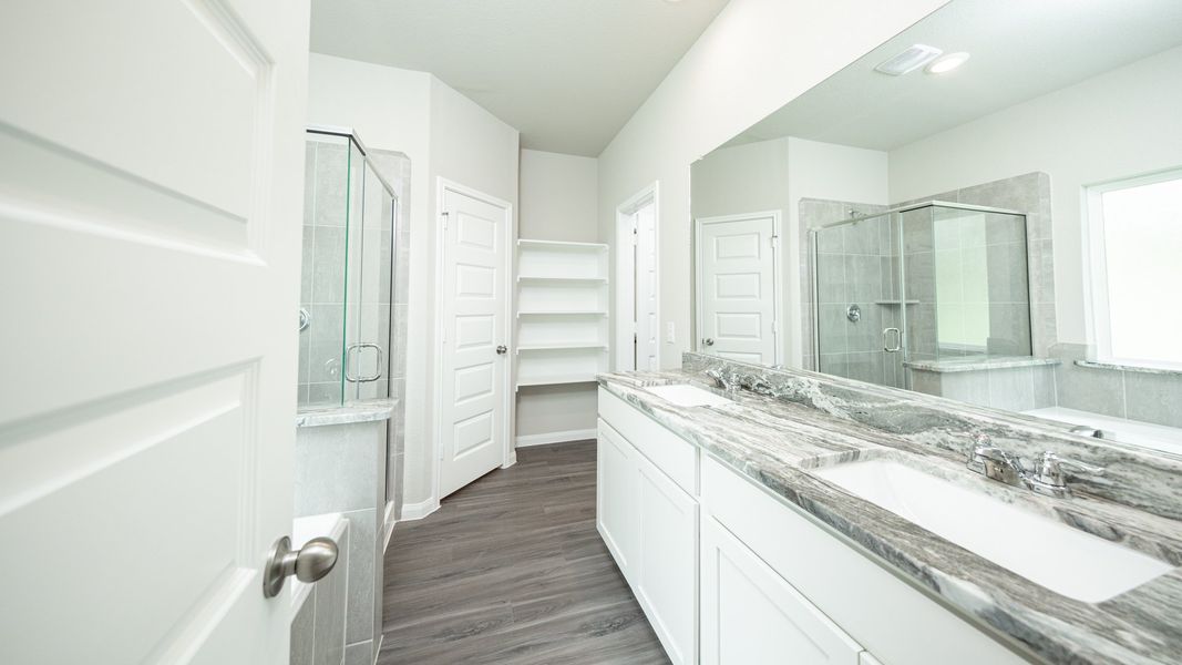 Representative furnished interior of a home built from the The Avola - Walden on Lake Conroe by Legend Homes in Lake Conroe Area Homes, Montgomery (Image 8).