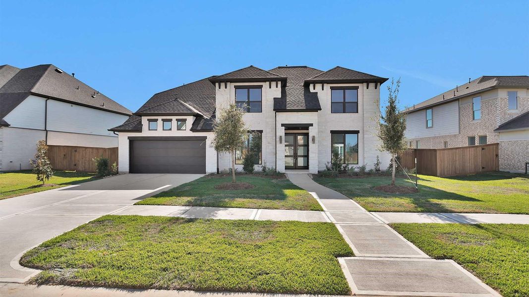 Front exterior of a new home in Katy Court 70', Katy, TX, highlighting curb appeal (Image 1). Front exterior of a new home in Katy Court 70', Katy, TX, highlighting curb appeal (Image 1).