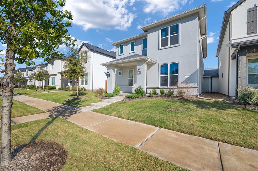 Beautiful stucco home with covered sitting porch in great neighborhood.