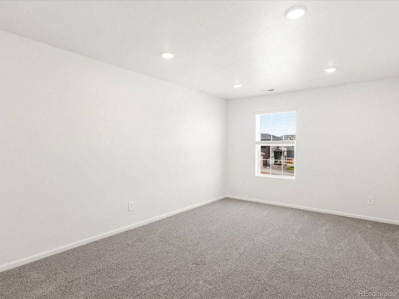 Spacious, unfurnished interior of a new home in Ridgeline Vista: The Flora Collection, Brighton (Image 27).