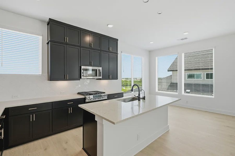 Representative furnished interior of a home built from the Athena by Chesmar Homes in Prominence Urban, San Antonio (Image 5).
