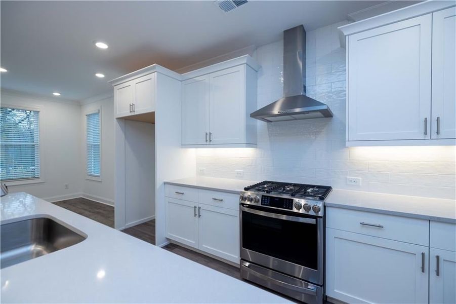 Under cabinet lighting is another highlight of the kitchen. Pictures represent a previously built home not the actual home, home is under construction.