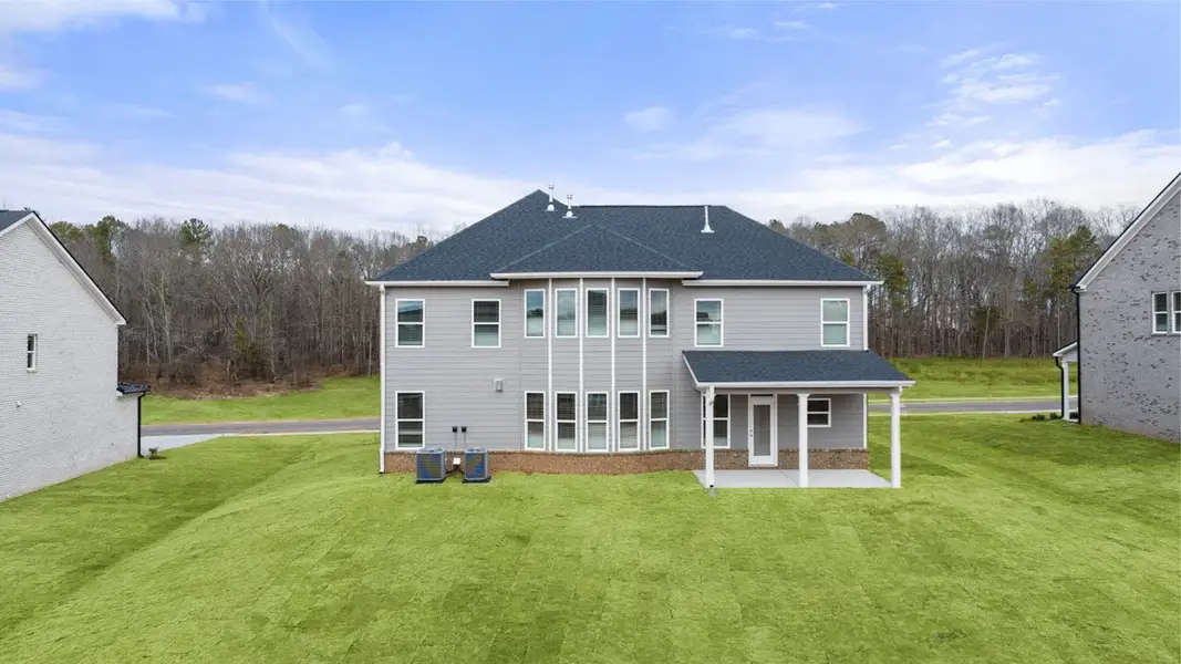 Exterior details and patio area of a home in Evergreen Crossing, Locust Grove (Image 2).