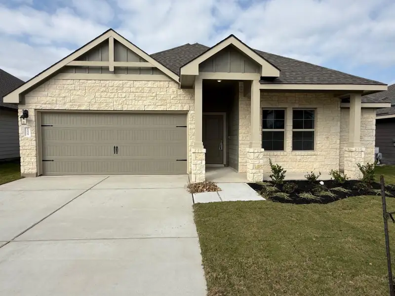 Front exterior of a new home in Southern Pointe, College Station, TX, highlighting curb appeal (Image 1). Front exterior of a new home in Southern Pointe, College Station, TX, highlighting curb appeal (Image 1).