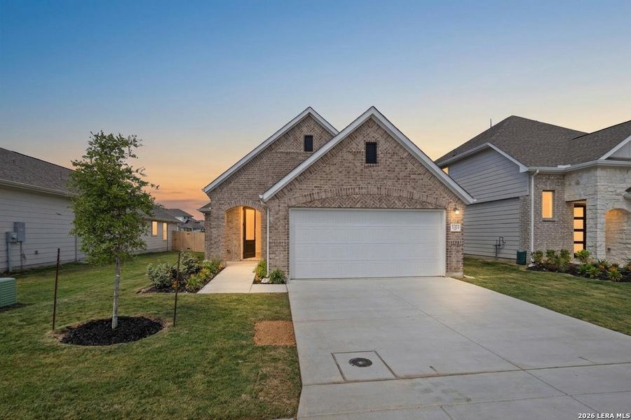Front exterior of a new home in Rhine Valley, Schertz, TX, highlighting curb appeal (Image 2). Front exterior of a new home in Rhine Valley, Schertz, TX, highlighting curb appeal (Image 2).