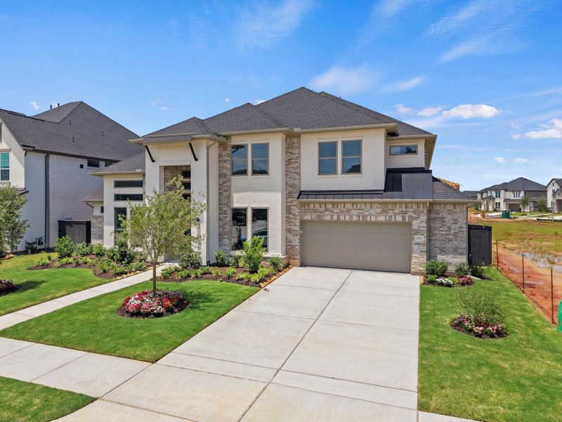 Front exterior of a new home in Harvest Green, Richmond, TX, highlighting curb appeal (Image 2). Front exterior of a new home in Harvest Green, Richmond, TX, highlighting curb appeal (Image 2).