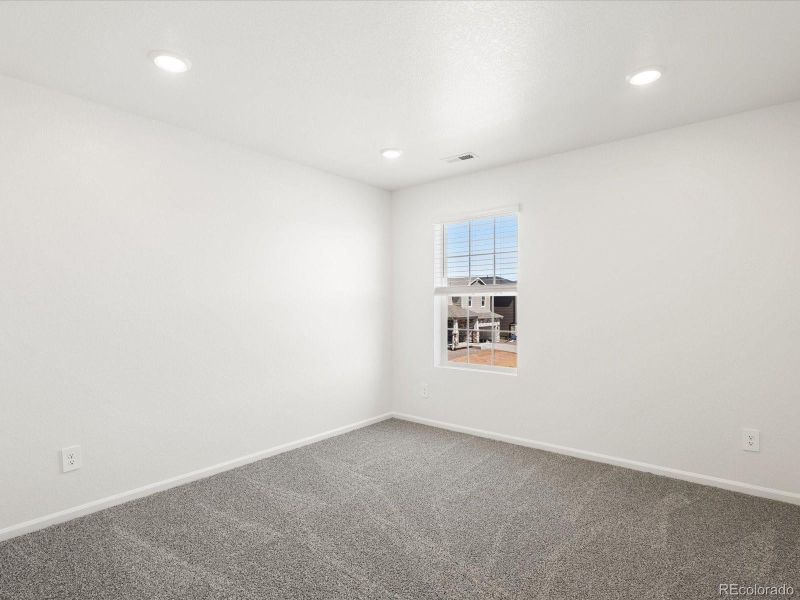 Spacious, unfurnished interior of a new home in Ridgeline Vista: The Flora Collection, Brighton (Image 31).