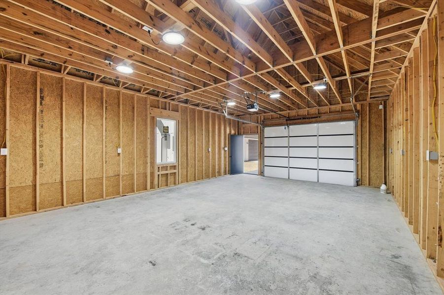 Garage featuring a garage door opener