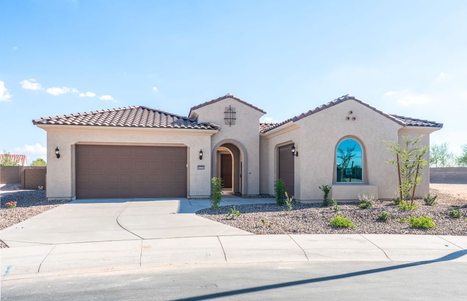 Front exterior of a new home in Sun City Anthem at Merrill Ranch, Florence, AZ, highlighting curb appeal (Image 2). Front exterior of a new home in Sun City Anthem at Merrill Ranch, Florence, AZ, highlighting curb appeal (Image 2).