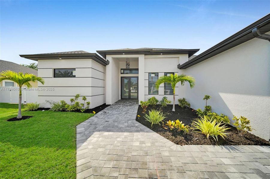 Front exterior of a new home in , Cape Coral, FL, highlighting curb appeal (Image 1).