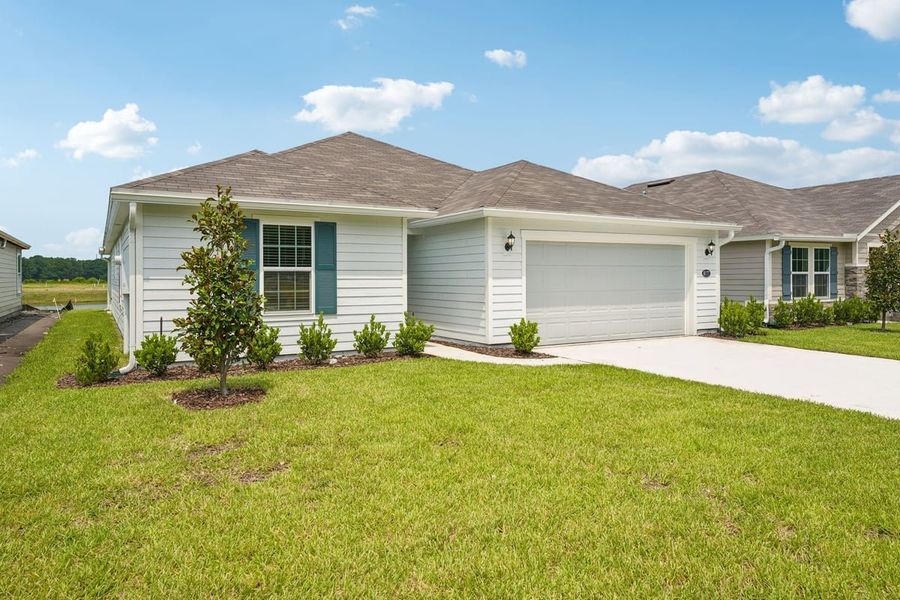 Front exterior of a new home in Hawkes Meadow, Jacksonville, FL, highlighting curb appeal (Image 1). Front exterior of a new home in Hawkes Meadow, Jacksonville, FL, highlighting curb appeal (Image 1).
