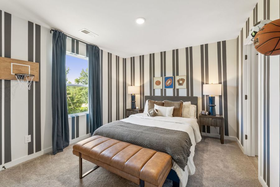 A bedroom with a large bed.