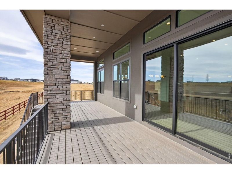 Exterior details and patio area of a home in RainDance, Windsor (Image 28).
