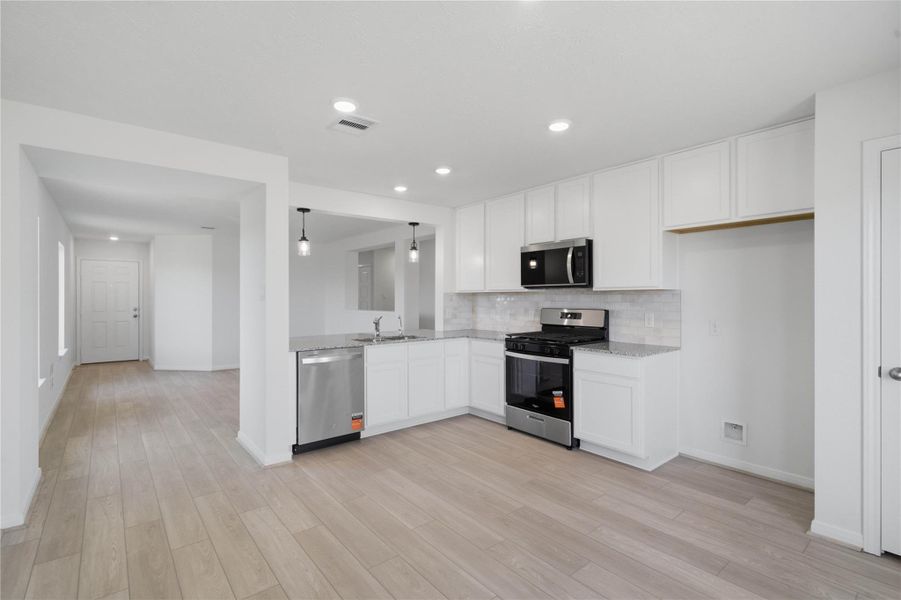 This kitchen/dining combination blends functional design with a bright, open feel.