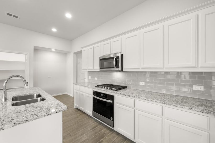 Representative exterior photo of a completed home built from the Jarvis by Impression Homes in Redden Farms, Midlothian, TX (Image 9).