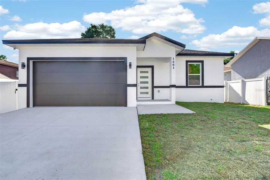 Front exterior of a new home in , Lakeland, FL, highlighting curb appeal (Image 25). Front exterior of a new home in , Lakeland, FL, highlighting curb appeal (Image 25).