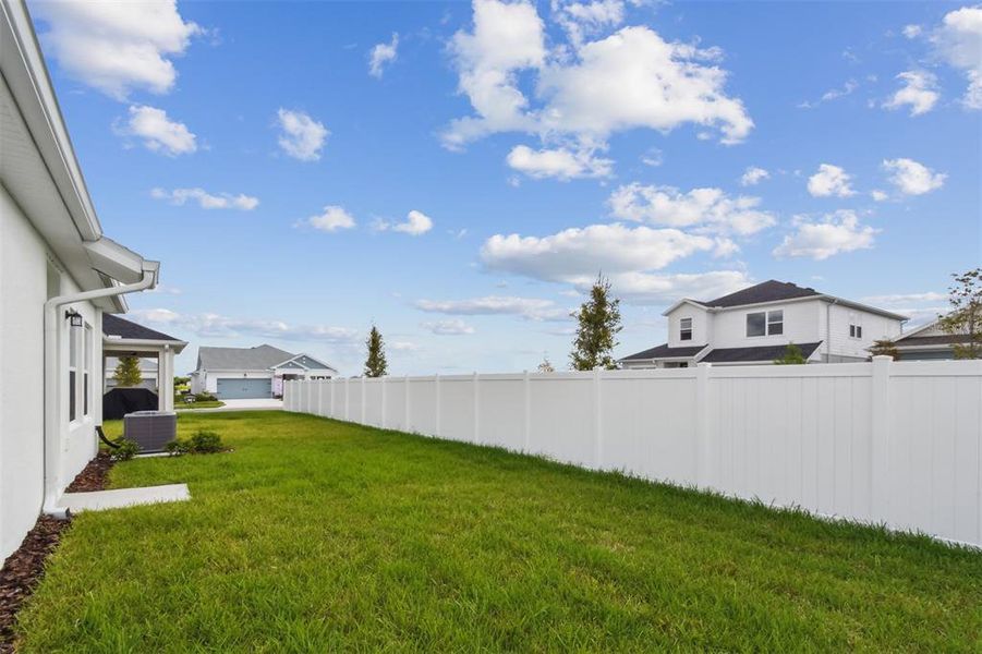 Exterior details and patio area of a home in The Peninsula at Rhodine Lake, Riverview (Image 21).