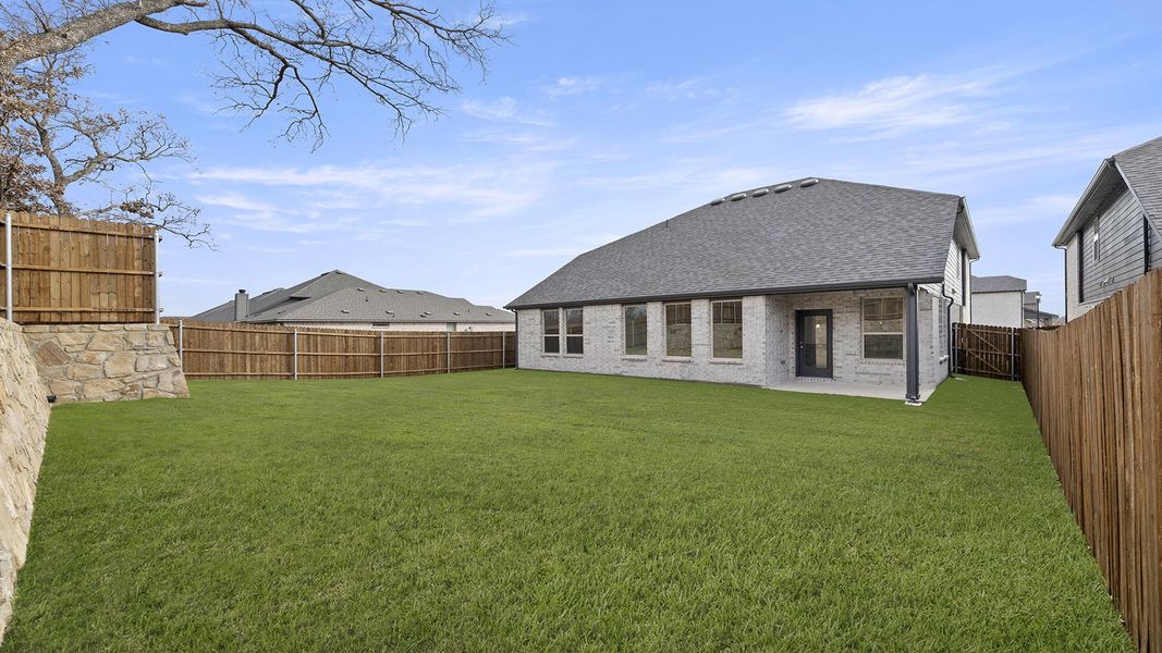 Exterior details and patio area of a home in Keeneland 50s, Aubrey (Image 20).
